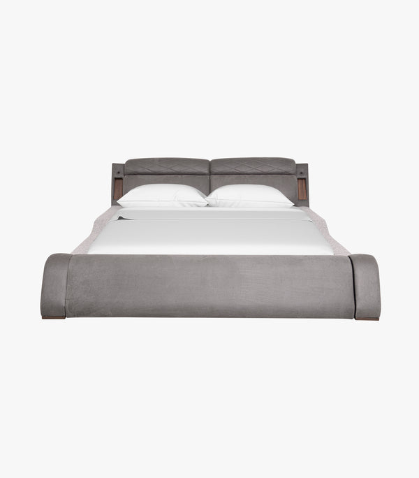 Cama King Size Booyer tapizada en tela color gris.